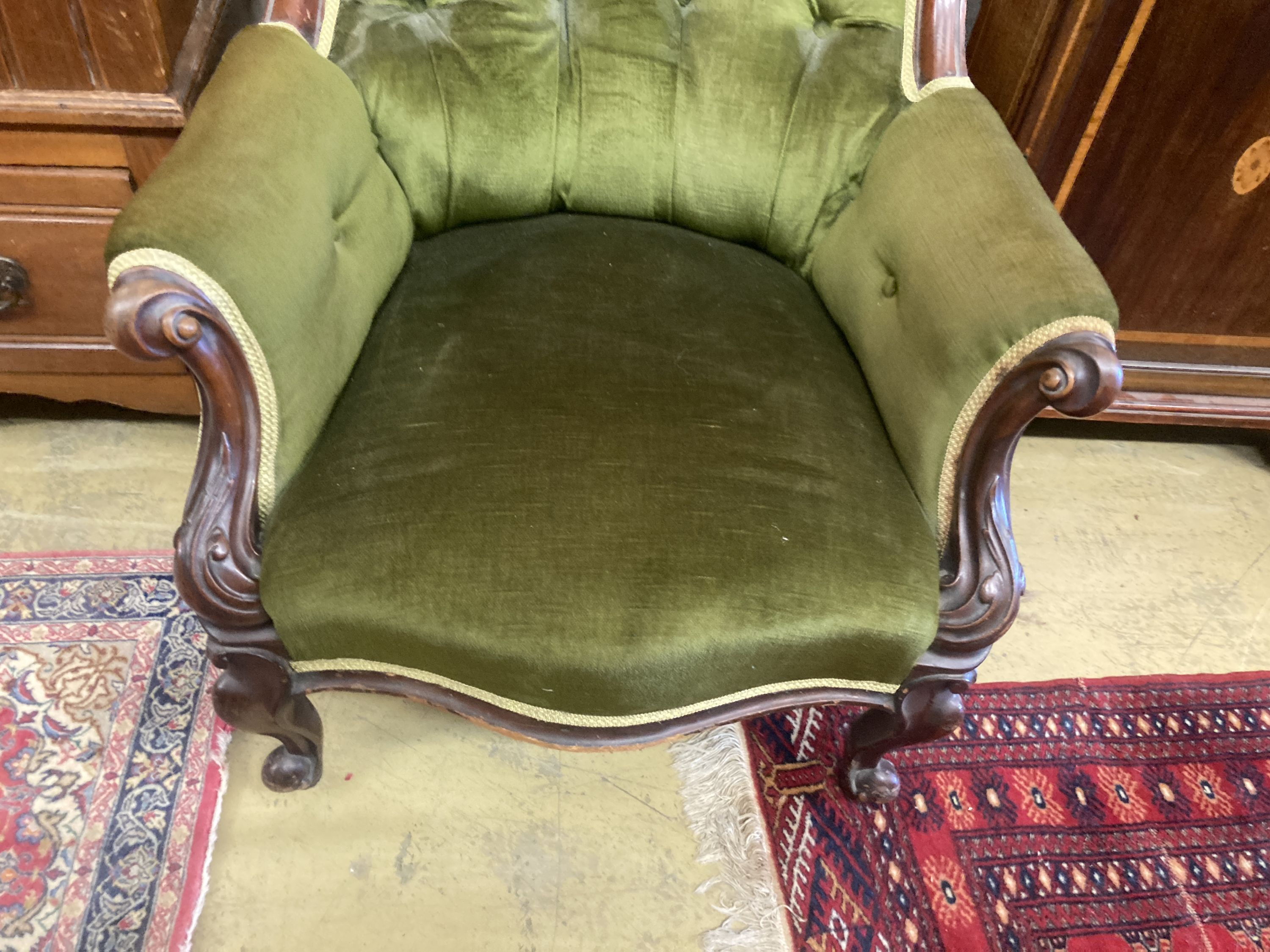 A Victorian mahogany spoonback armchair, width 88cm, depth 80cm, height 94cm